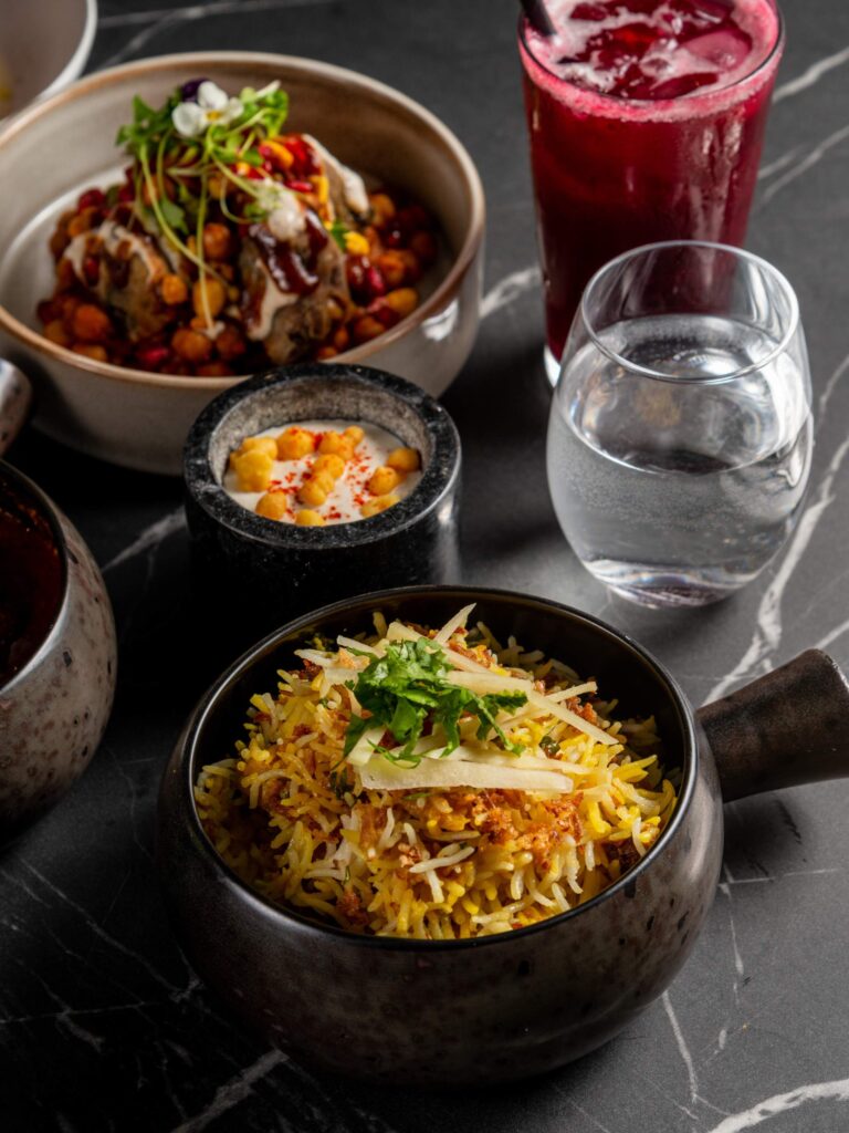 Golden curry dish with rice served in traditional bowl